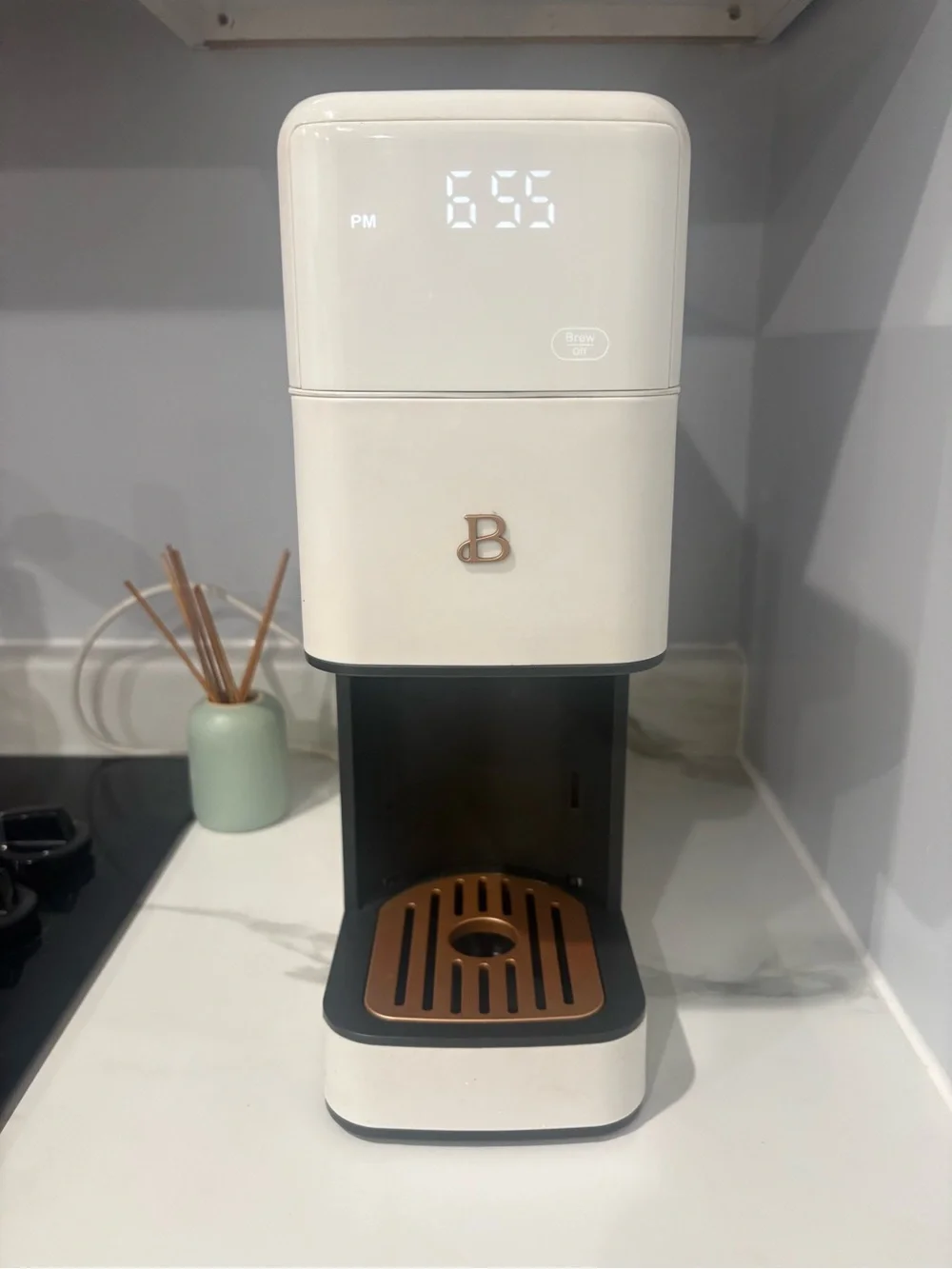 Compact White Single-Serve Coffee rewer with ronze Accents